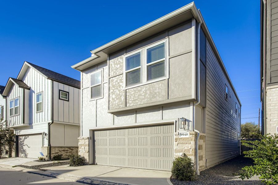 Front exterior of a new home in , Houston, TX, highlighting curb appeal (Image 24).