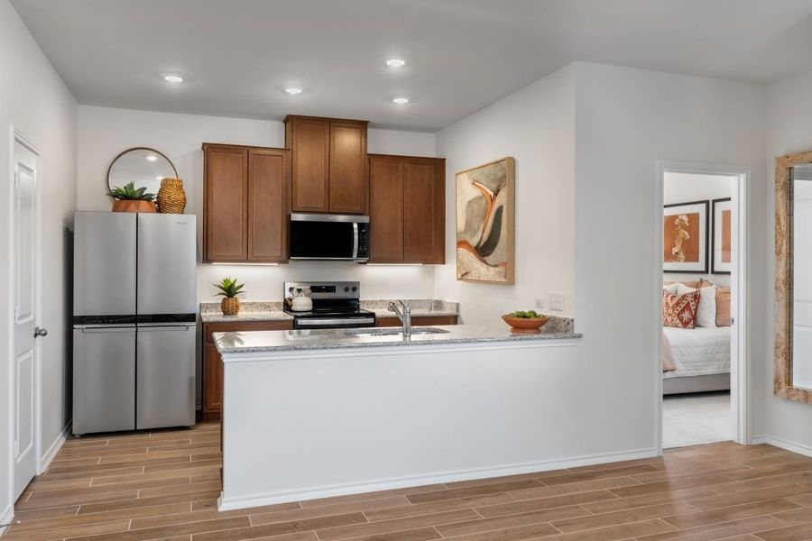 Representative furnished interior of a home built from the 1360 Modeled by KB Home in Creekside at Estancia, Austin (Image 6).