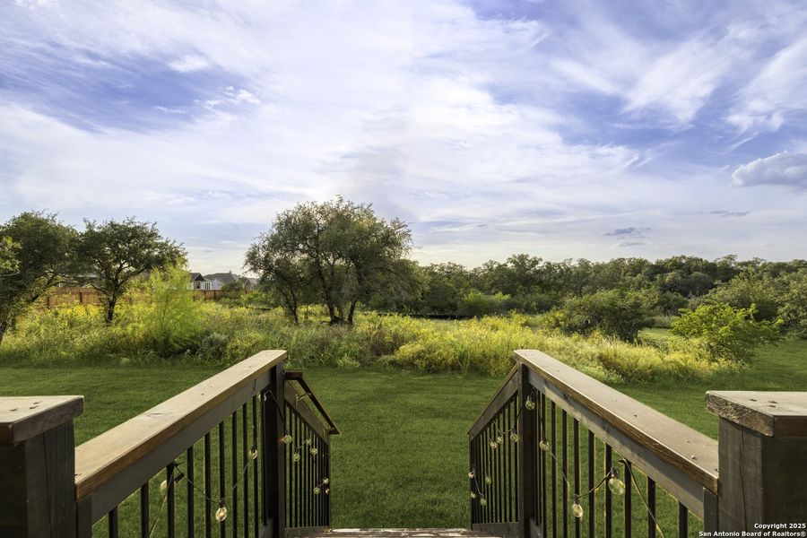 Front exterior of a new home in Megan's Landing 1/2 Acre, San Antonio, TX, highlighting curb appeal (Image 24). Front exterior of a new home in Megan's Landing 1/2 Acre, San Antonio, TX, highlighting curb appeal (Image 24).