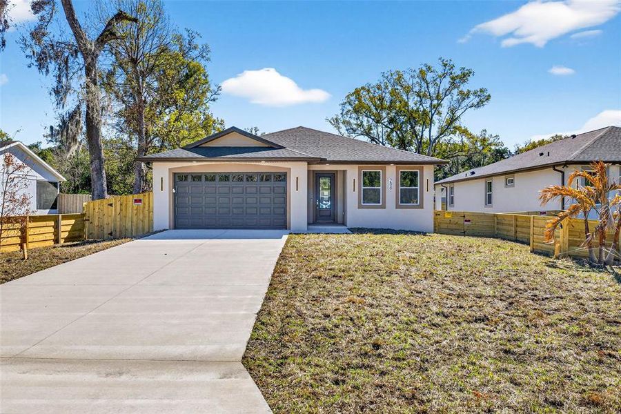 Front exterior of a new home in , Masaryktown, FL, highlighting curb appeal (Image 27).