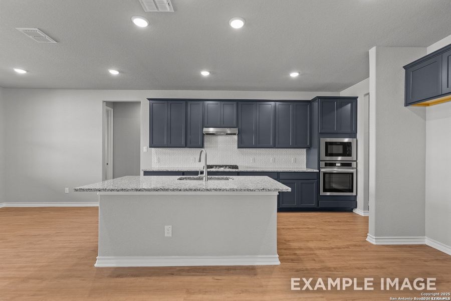 Furnished interior view inside a new home in Potranco Oaks, Castroville (Image 11).
