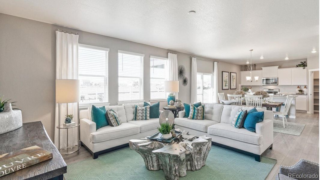 Furnished interior view inside a new home in Trails at Crowfoot, Parker (Image 1).