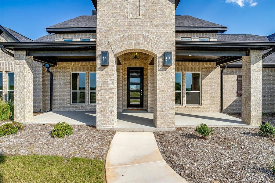 Front exterior of a new home in Rocky Top Ranch, Reno, TX, highlighting curb appeal (Image 20). Front exterior of a new home in Rocky Top Ranch, Reno, TX, highlighting curb appeal (Image 20).