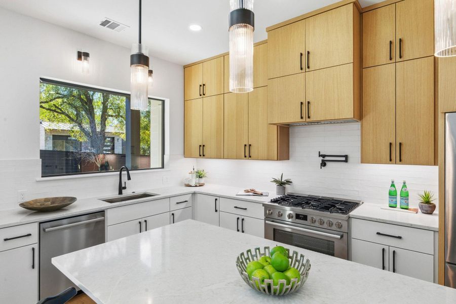 Kitchen featuring stainless steel appliances, decorative light fixtures, light granite countertops, tasteful backsplash, and recessed lighting