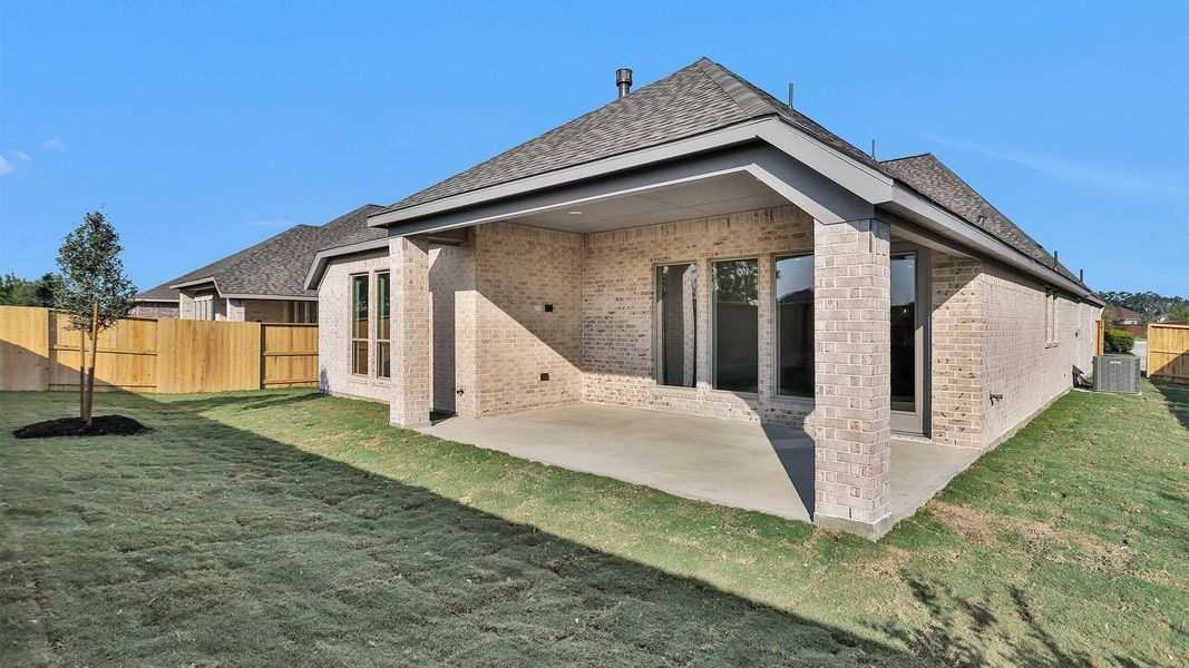 Exterior details and patio area of a home in Serenity 55+ Active Adult, Manvel (Image 3).