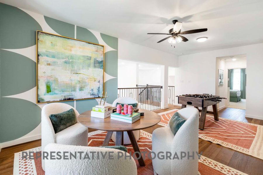 Dining space with baseboards, ceiling fan, and wood finished floors Dining space with baseboards, ceiling fan, and wood finished floors