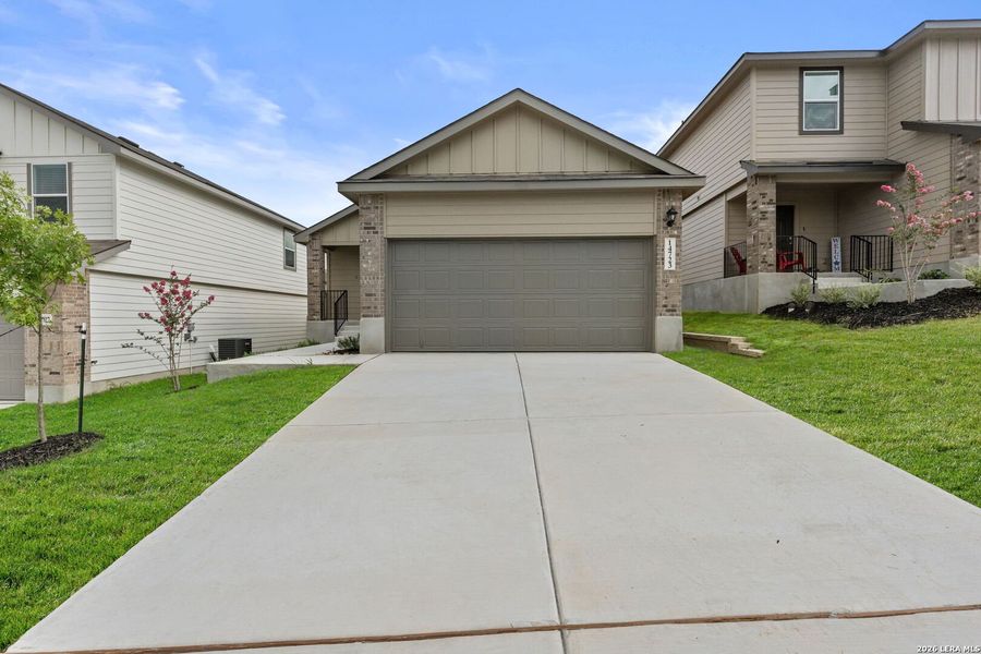 Front exterior of a new home in Stonehill, San Antonio, TX, highlighting curb appeal (Image 1). Front exterior of a new home in Stonehill, San Antonio, TX, highlighting curb appeal (Image 1).