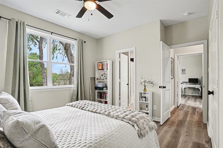 1st Floor Bedroom with wood finished floors and a ceiling fan