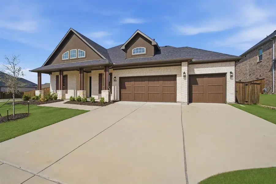 Front exterior of a new home in Sonoma Verde, Rockwall, TX, highlighting curb appeal (Image 2). Front exterior of a new home in Sonoma Verde, Rockwall, TX, highlighting curb appeal (Image 2).