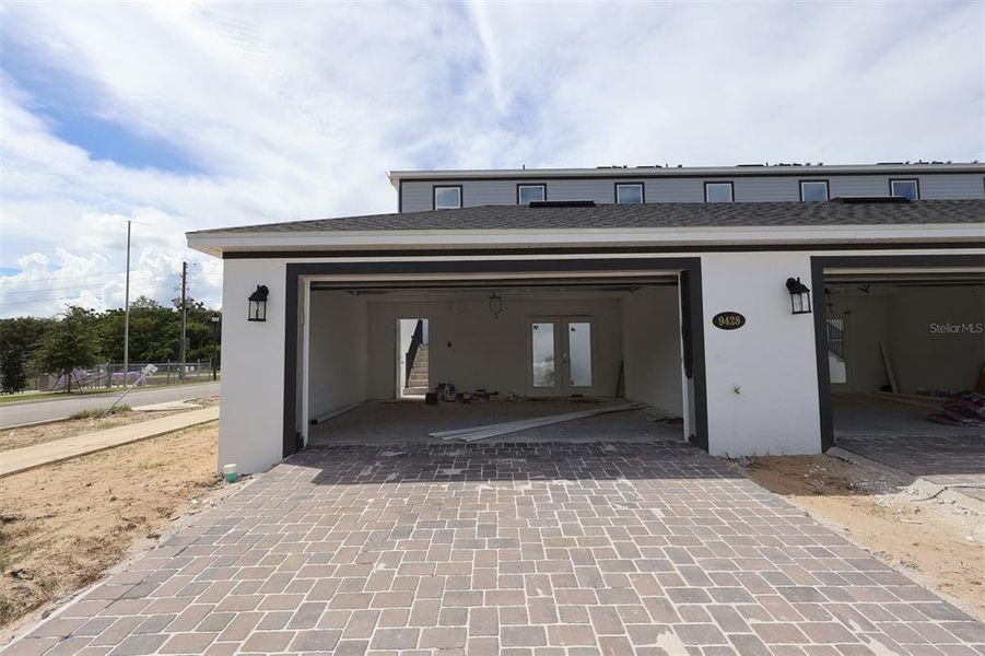 Exterior details and patio area of a home in Tribute at Ovation, Winter Garden (Image 4).