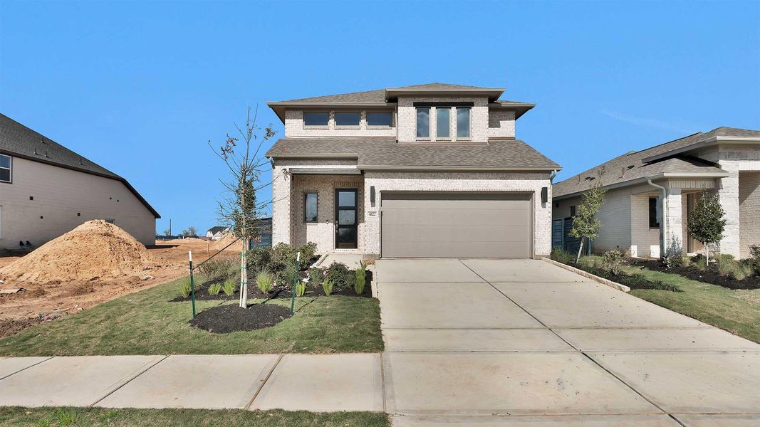 Front exterior of a new home in Austin Point, Richmond, TX, highlighting curb appeal (Image 2).