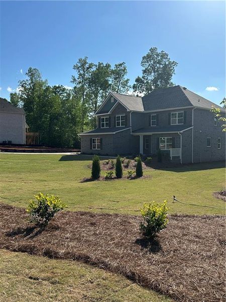 Front exterior of a new home in , Villa Rica, GA, highlighting curb appeal (Image 2). Front exterior of a new home in , Villa Rica, GA, highlighting curb appeal (Image 2).