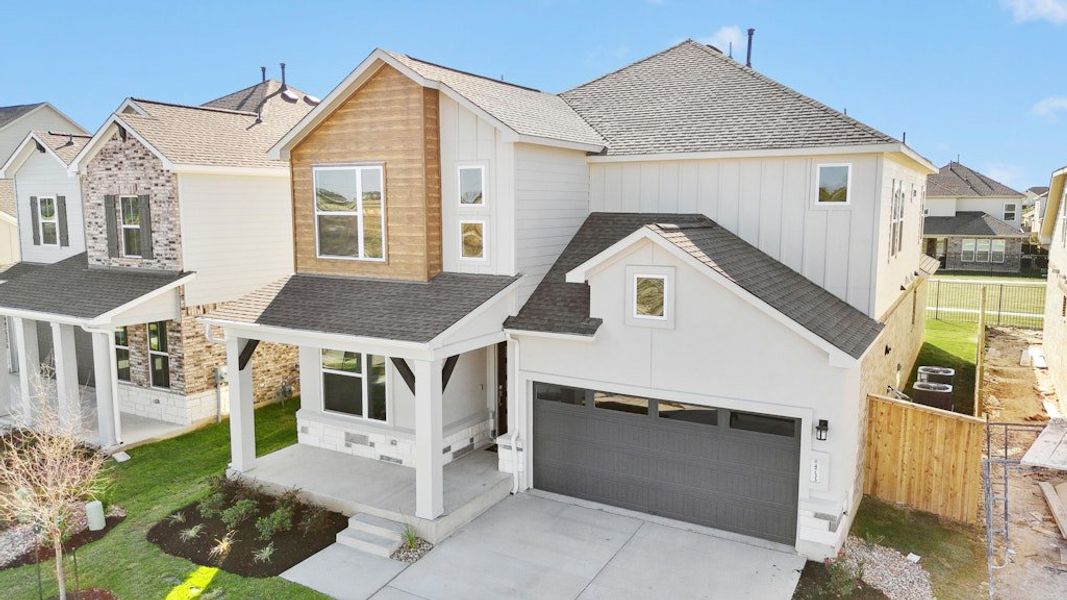 Front exterior of a new home in University Heights, Round Rock, TX, highlighting curb appeal (Image 20).