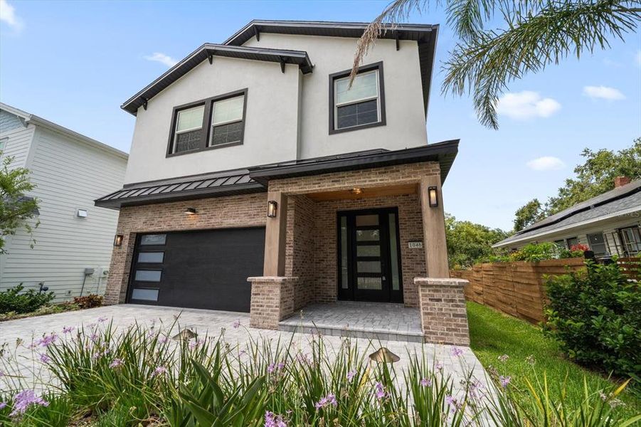 Front exterior of a new home in , Dunedin, FL, highlighting curb appeal (Image 26). Front exterior of a new home in , Dunedin, FL, highlighting curb appeal (Image 26).
