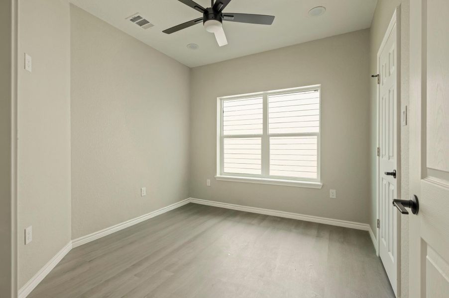 Unfurnished bedroom with light wood-style floors, ceiling fan, and recessed lighting