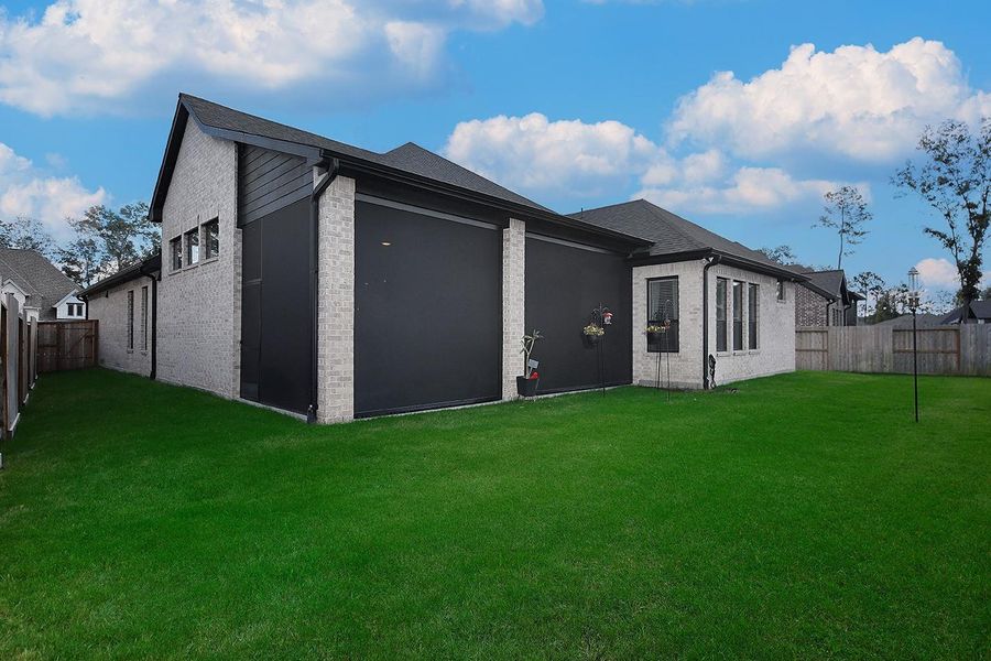 Exterior details and patio area of a home in The Highlands - 65', Porter (Image 24). Exterior details and patio area of a home in The Highlands - 65', Porter (Image 24).