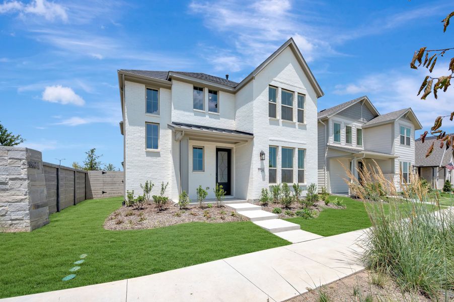 Front exterior of a new home in Painted Tree, McKinney, TX, highlighting curb appeal (Image 2). Front exterior of a new home in Painted Tree, McKinney, TX, highlighting curb appeal (Image 2).