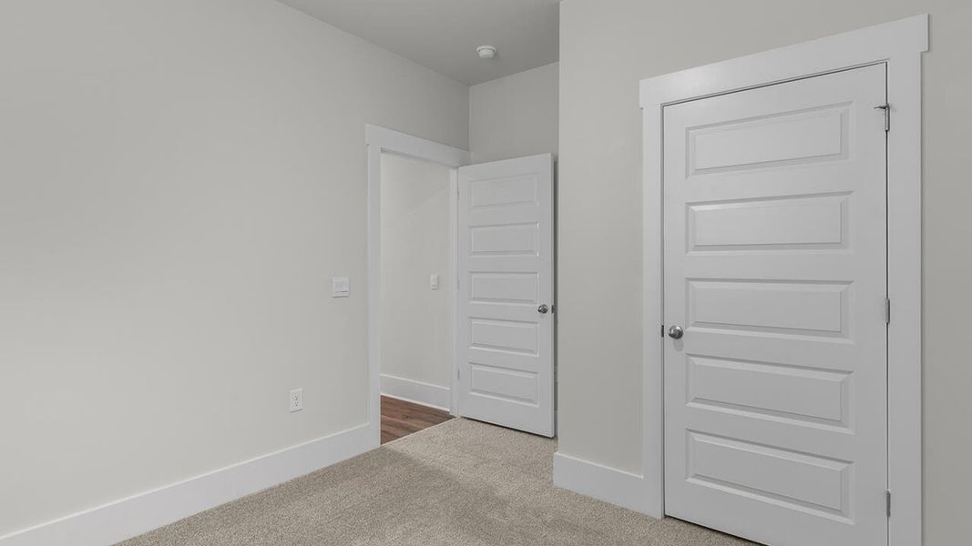 Spacious, unfurnished interior of a new home in The Haven at Indigo Preserve, Leland (Image 32).