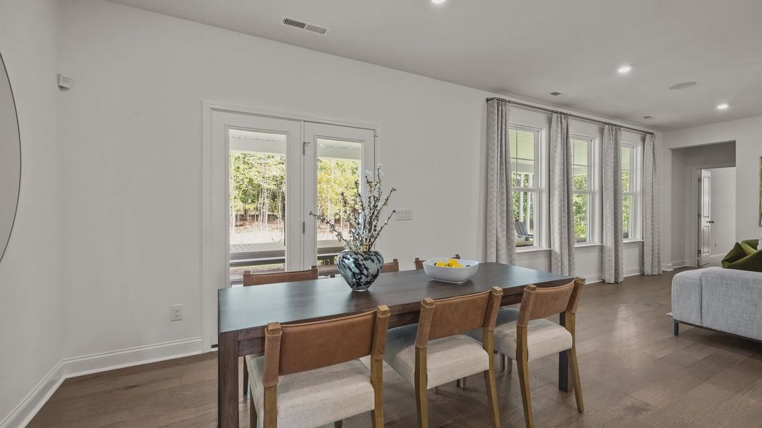 Eat-in breakfast area with large windows and access to the extended rear covered porch, in the Townsend Design by DRB Homes