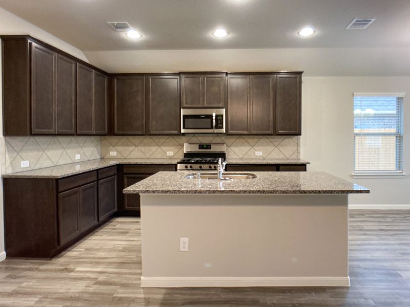 Representative furnished interior of a home built from the Floor Plan 1816 by Colina Homes in Grand Magnolia, Magnolia (Image 5). Representative furnished interior of a home built from the Floor Plan 1816 by Colina Homes in Grand Magnolia, Magnolia (Image 5).