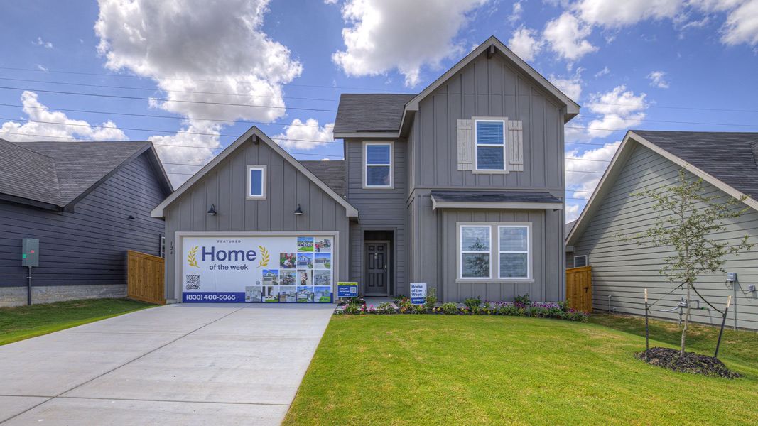 Front exterior of a new home in Trace, San Marcos, TX, highlighting curb appeal (Image 1). Front exterior of a new home in Trace, San Marcos, TX, highlighting curb appeal (Image 1).