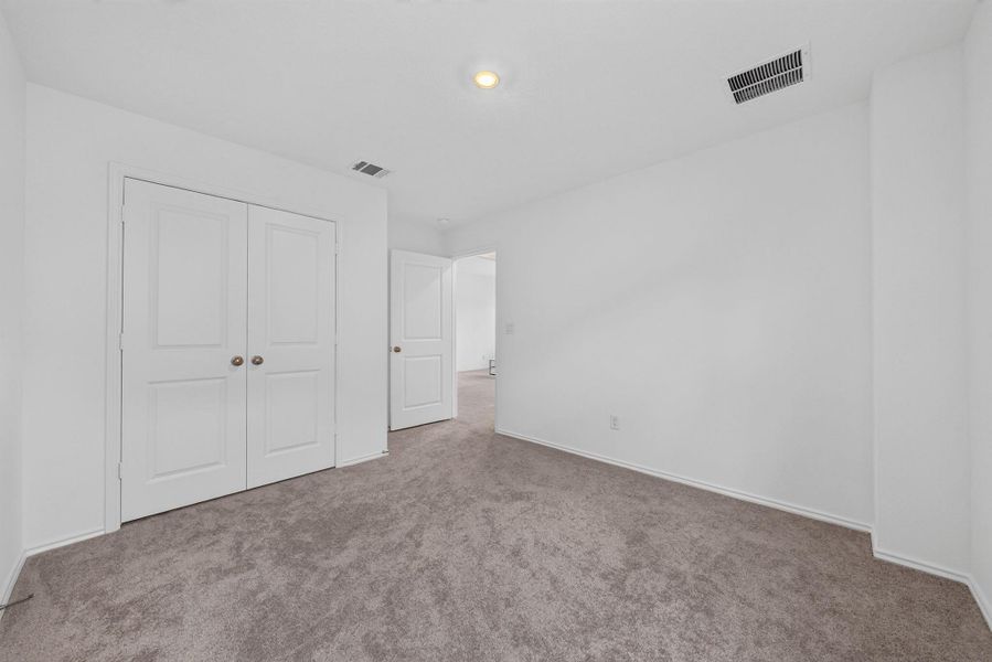 A well-maintained carpeted bedroom awaits your personal touch. A well-maintained carpeted bedroom awaits your personal touch.