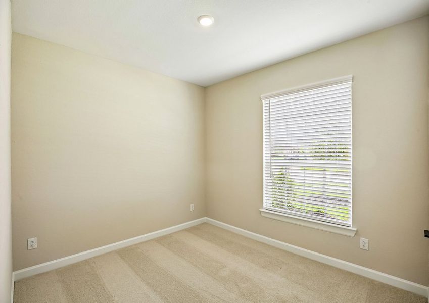 Secondary bedroom feeatures an oversized window. Secondary bedroom feeatures an oversized window.