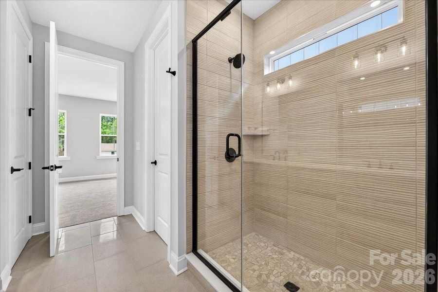 Primary tiled walk-in shower
