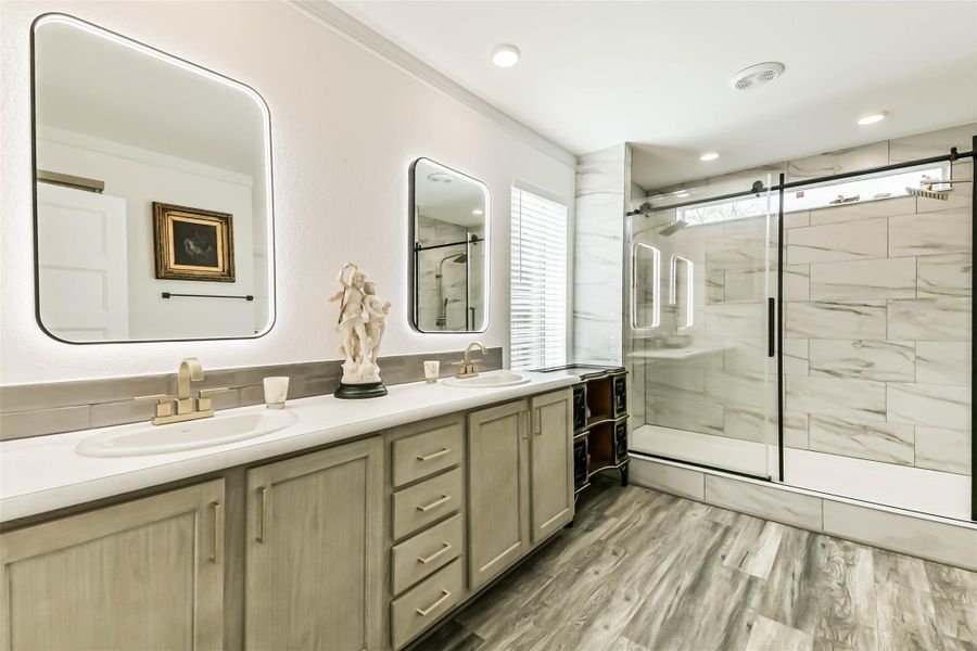 Enjoy your Master Bath retreat with oversized shower, 3 back-lit mirrors & vanity area.