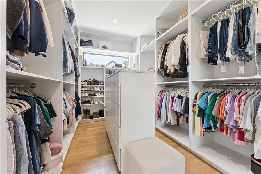 Walk in closet featuring light wood-style flooring
