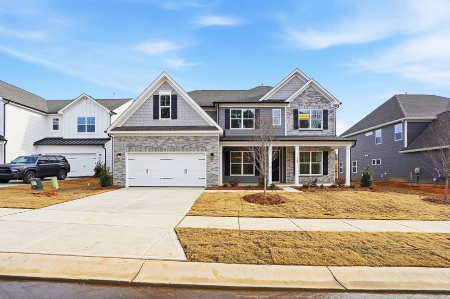 Front exterior of a new home in Carrington, Stanley, NC, highlighting curb appeal (Image 28). Front exterior of a new home in Carrington, Stanley, NC, highlighting curb appeal (Image 28).