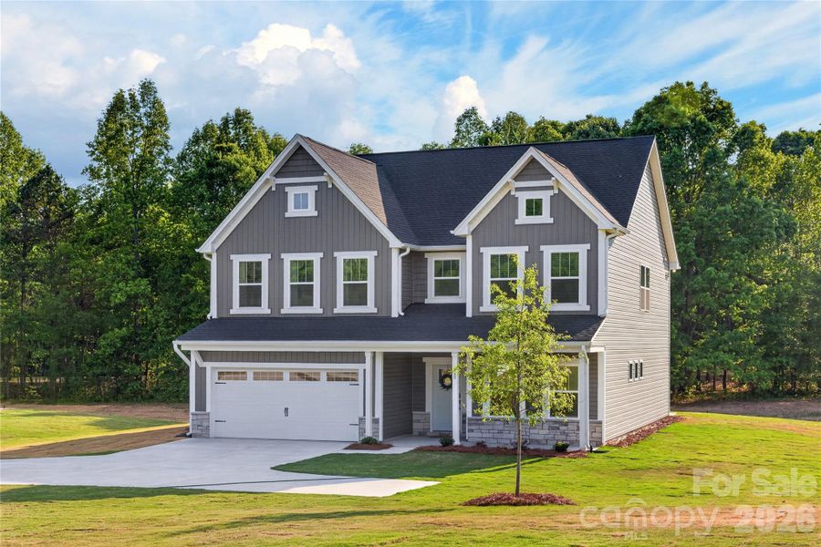 Front exterior of a new home in , Troutman, NC, highlighting curb appeal (Image 25).