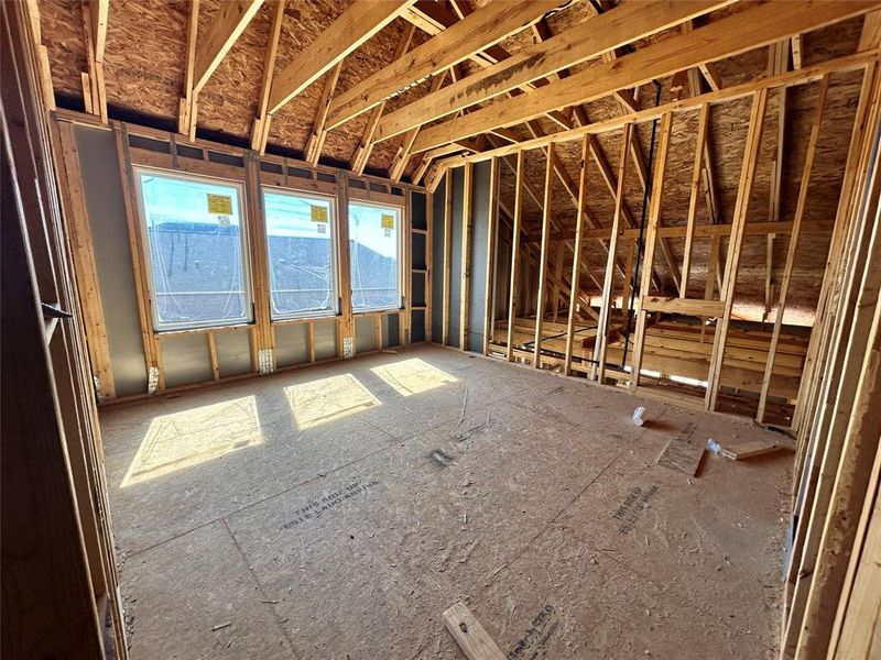 Next to the media room is a bright game room, filled with natural light streaming through large windows. This space is perfect for table games, pool table, or simply relaxing while enjoying the open, airy atmosphere.