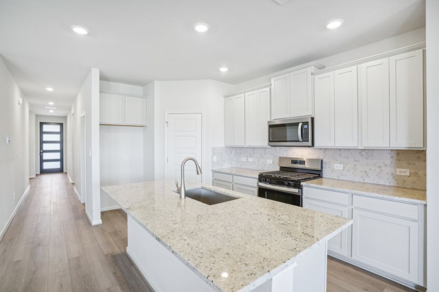 Kitchen in the Callaghan floorplan at a Meritage Homes community.