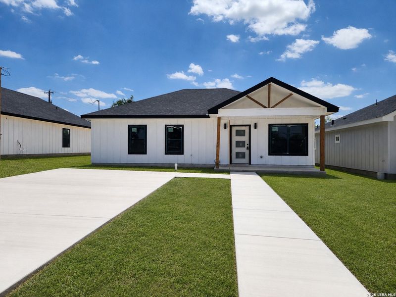 Front exterior of a new home in , Eagle Pass, TX, highlighting curb appeal (Image 1). Front exterior of a new home in , Eagle Pass, TX, highlighting curb appeal (Image 1).
