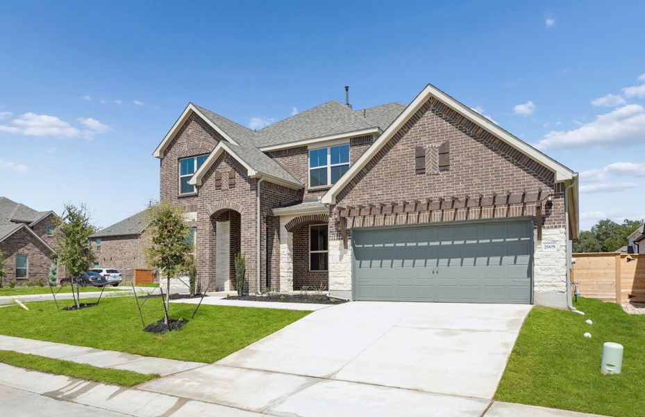 Front exterior of a new home in Bluffview Reserve, Leander, TX, highlighting curb appeal (Image 28).
