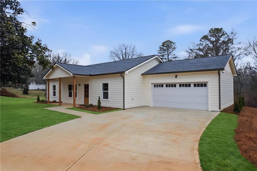 Front exterior of a new home in , Tate, GA, highlighting curb appeal (Image 2). Front exterior of a new home in , Tate, GA, highlighting curb appeal (Image 2).