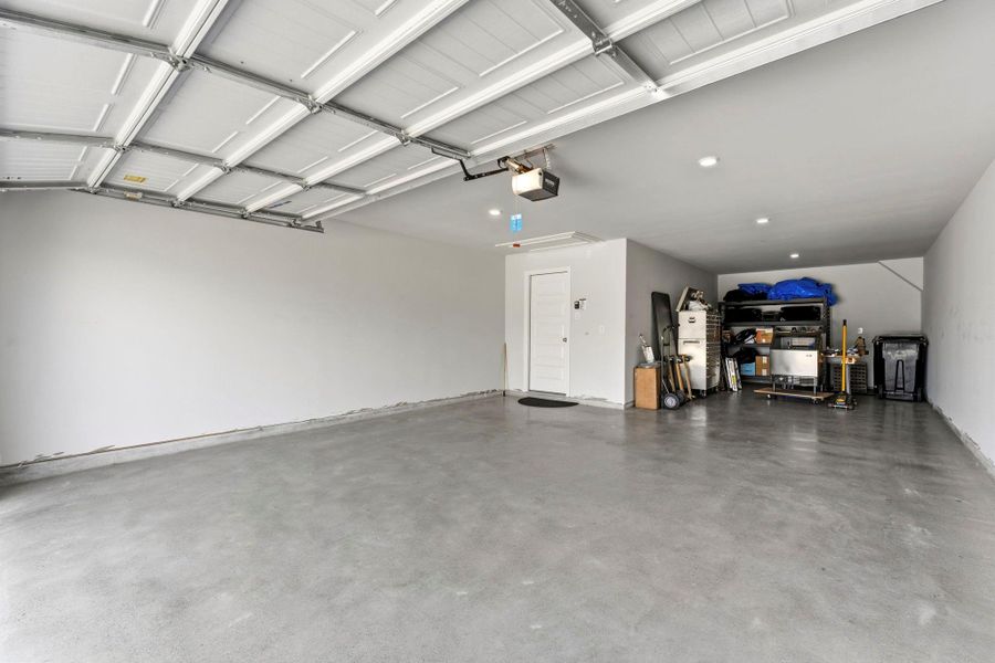 3 Car Tandem Garage with Polished Concrete flooring. The Spacious Garage has recessed LED Lighting and will accommodate 1/2 or 3/4 Ton pickup plus mid-sized SUV and still have room for storage. Lots of possibilites! It also has natural light with 2 windows above garage door. MY Q Garage Door Opener is also another plus! 3 Car Tandem Garage with Polished Concrete flooring. The Spacious Garage has recessed LED Lighting and will accommodate 1/2 or 3/4 Ton pickup plus mid-sized SUV and still have room for storage. Lots of possibilites! It also has natural light with 2 windows above garage door. MY Q Garage Door Opener is also another plus!