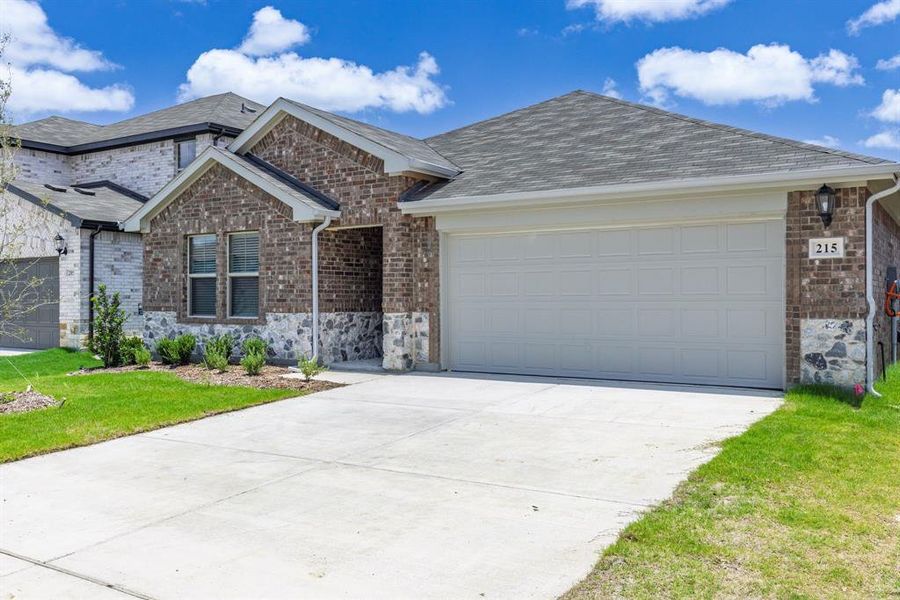 Front exterior of a new home in Stratton Place, Greenville, TX, highlighting curb appeal (Image 19). Front exterior of a new home in Stratton Place, Greenville, TX, highlighting curb appeal (Image 19).