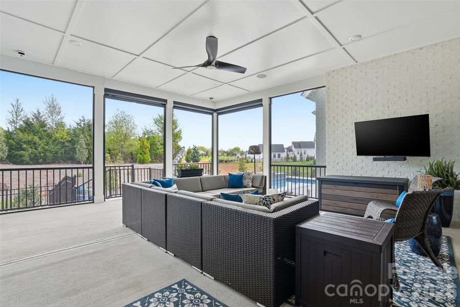 Covered porch with motorized screens