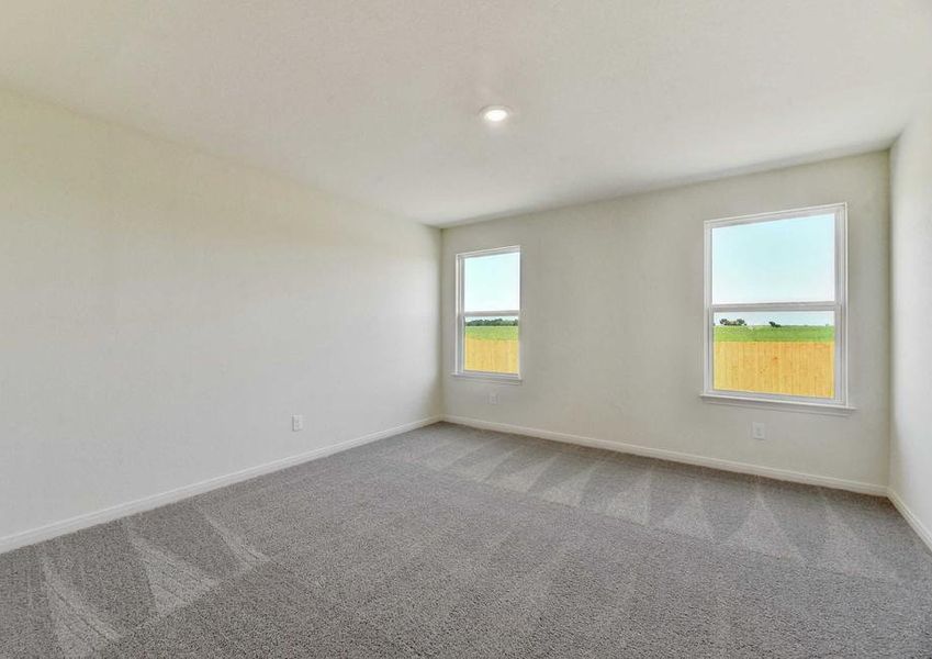 Frio bedroom with overhead light, two white frame windows, and light brown carpet