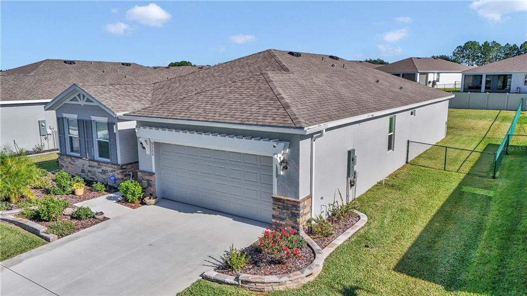 Front exterior of a new home in JB Ranch, Ocala, FL, highlighting curb appeal (Image 21). Front exterior of a new home in JB Ranch, Ocala, FL, highlighting curb appeal (Image 21).