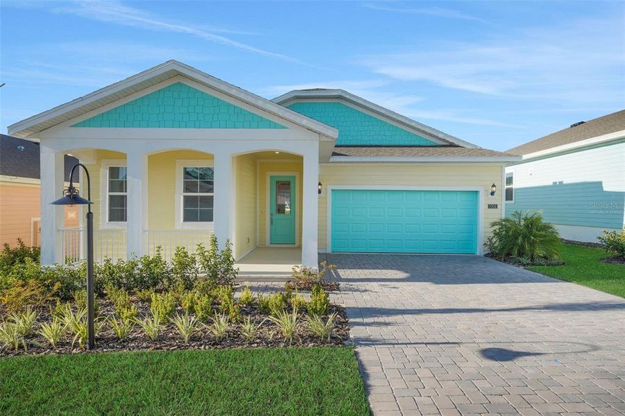 Front exterior of a new home in Green Key Village, Lady Lake, FL, highlighting curb appeal (Image 19).