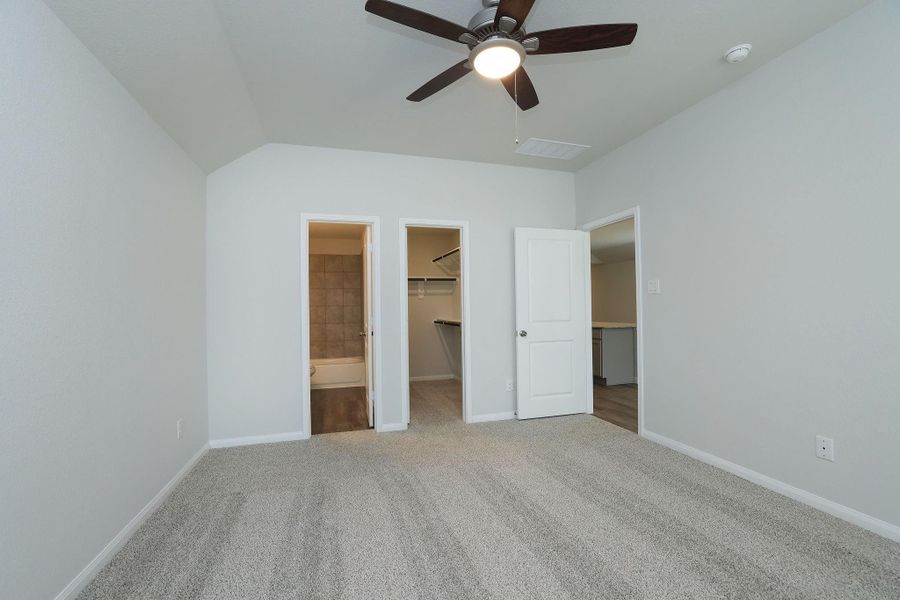 The en-suite bathroom and a walk-in closet are a dream. The neutral walls offer a fresh, clean look.