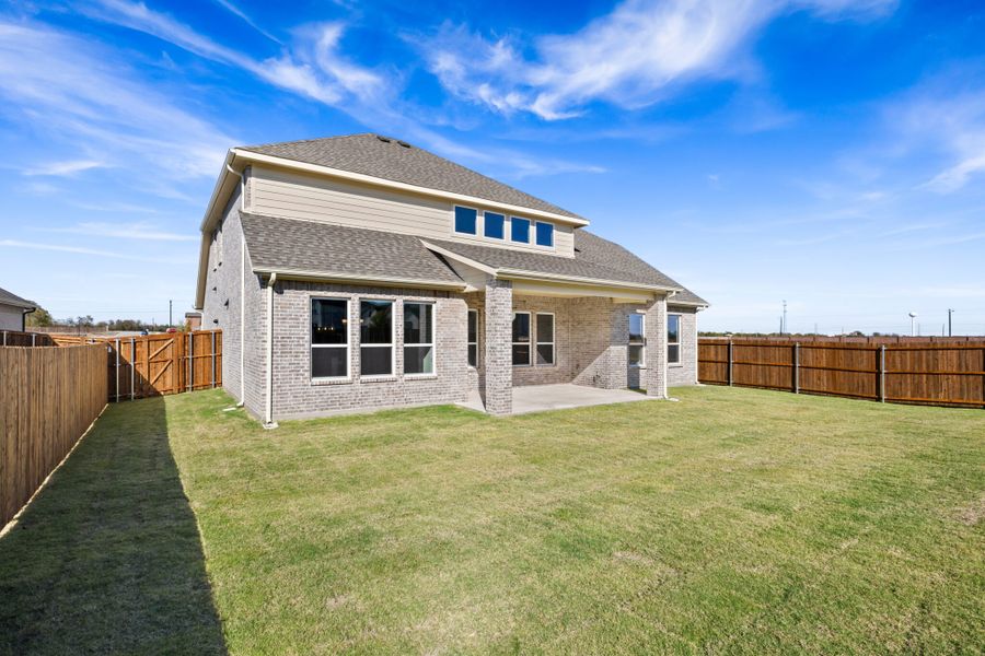 Exterior details and patio area of a home in Lake Breeze, Lavon (Image 24).