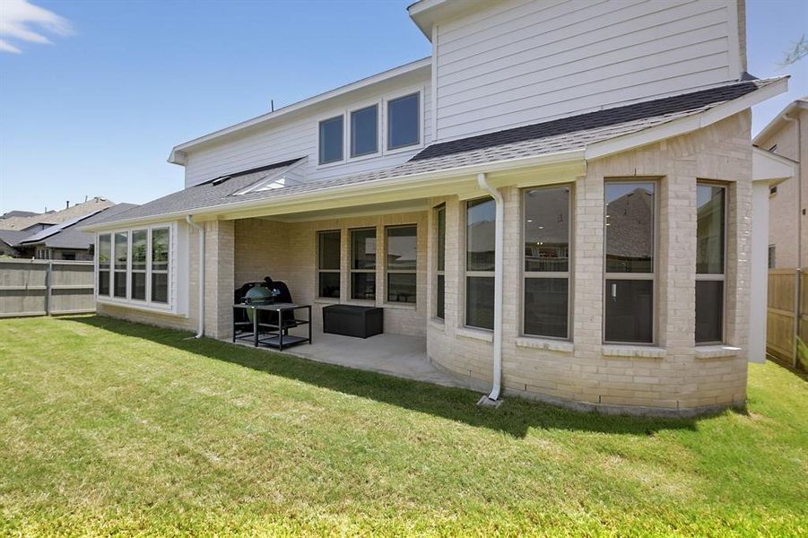 Exterior details and patio area of a home in Pecan Square, Northlake (Image 4).