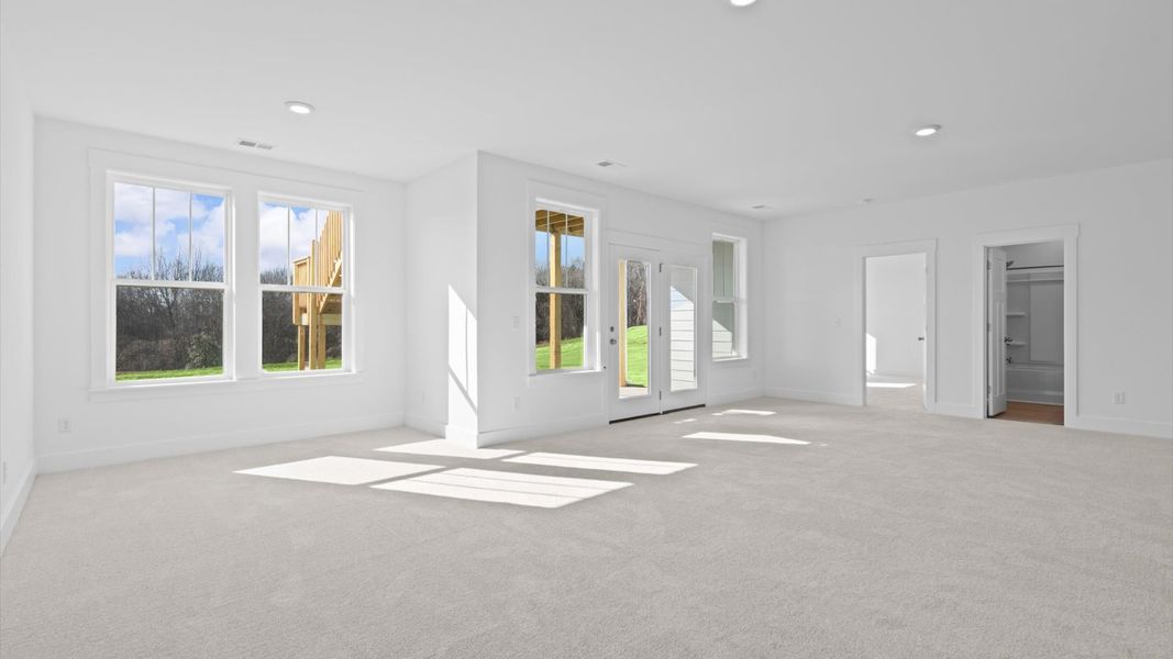 This eye-catching basement space combines a wet bar with guest accommodations for a memorable experience.