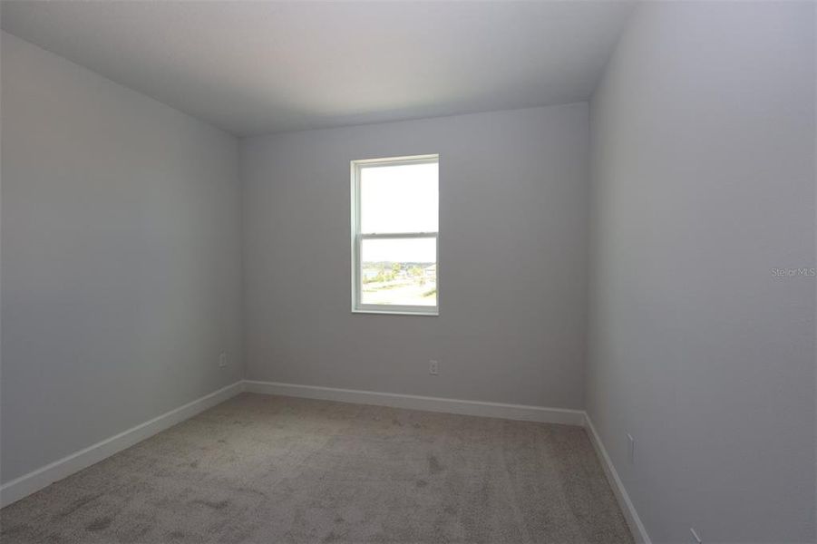 Spacious, unfurnished interior of a new home in Lake Star at Ovation, Winter Garden (Image 23).