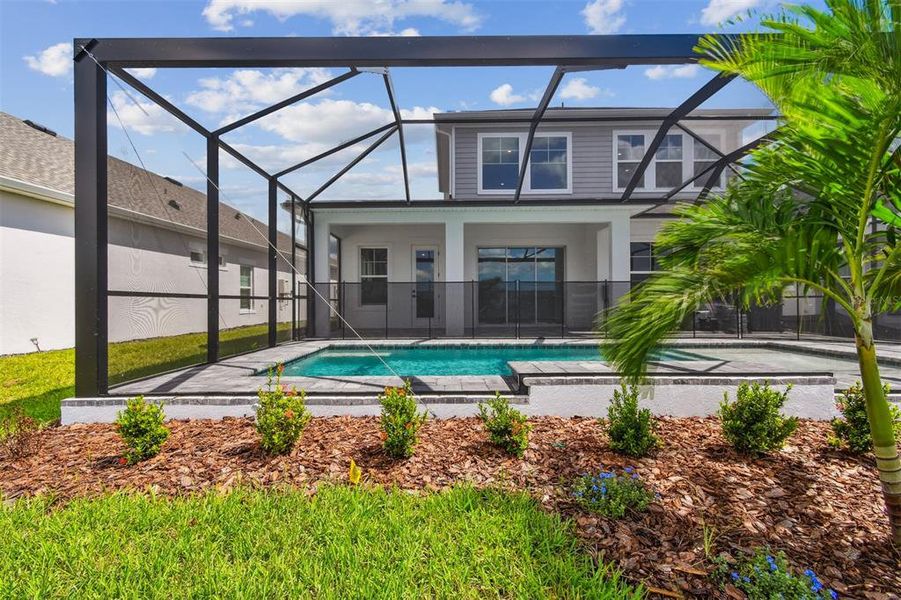 Exterior details and patio area of a home in Emerald Landing at Waterside at Lakewood Ranch – Lake Series, Sarasota (Image 22).