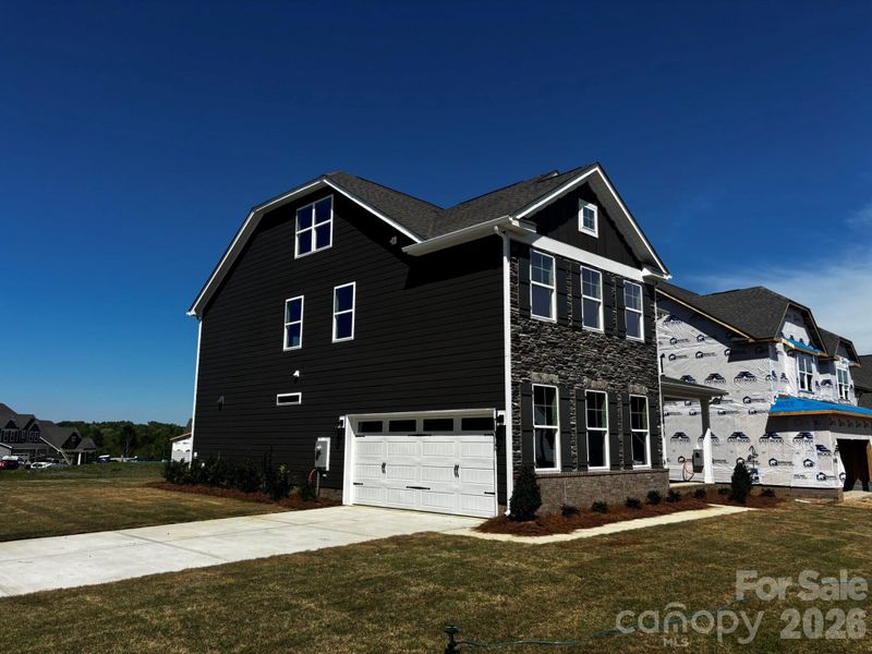 Front exterior of a new home in Waterford Commons, Rock Hill, SC, highlighting curb appeal (Image 2). Front exterior of a new home in Waterford Commons, Rock Hill, SC, highlighting curb appeal (Image 2).